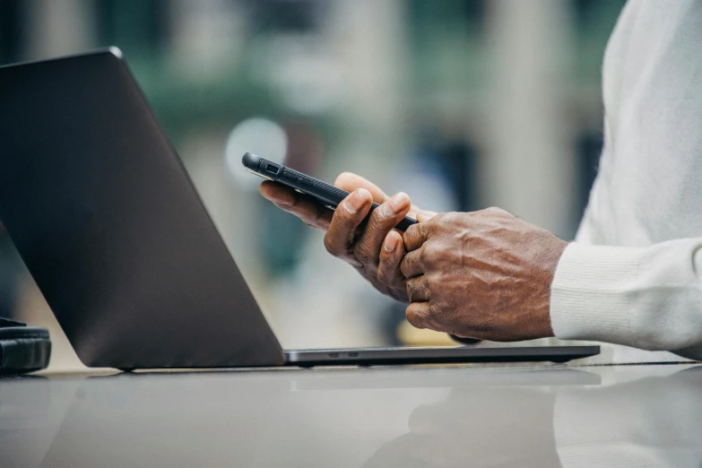 a close up of a person using a cell phone, trending on pexels, renaissance, with a laptop on his lap, digital health, afro tech, corporate phone app icon