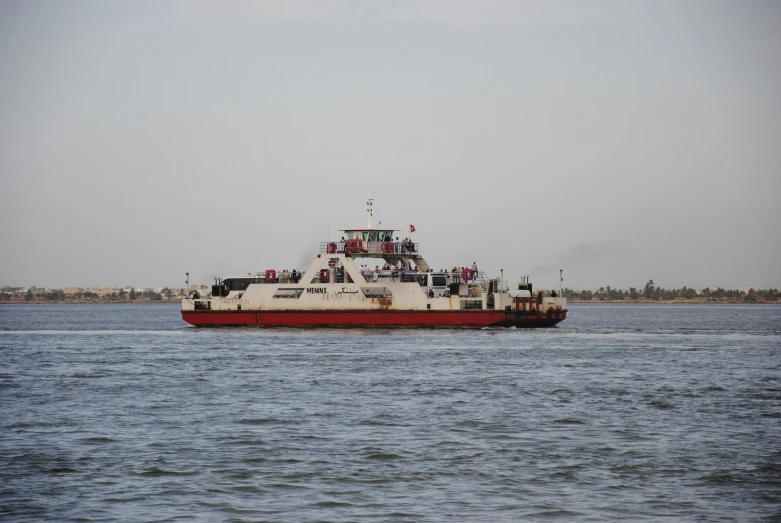 a red and white boat on a body of water, hurufiyya, bucklebury ferry, utilitarian cargo ship, iraq nadar, thumbnail
