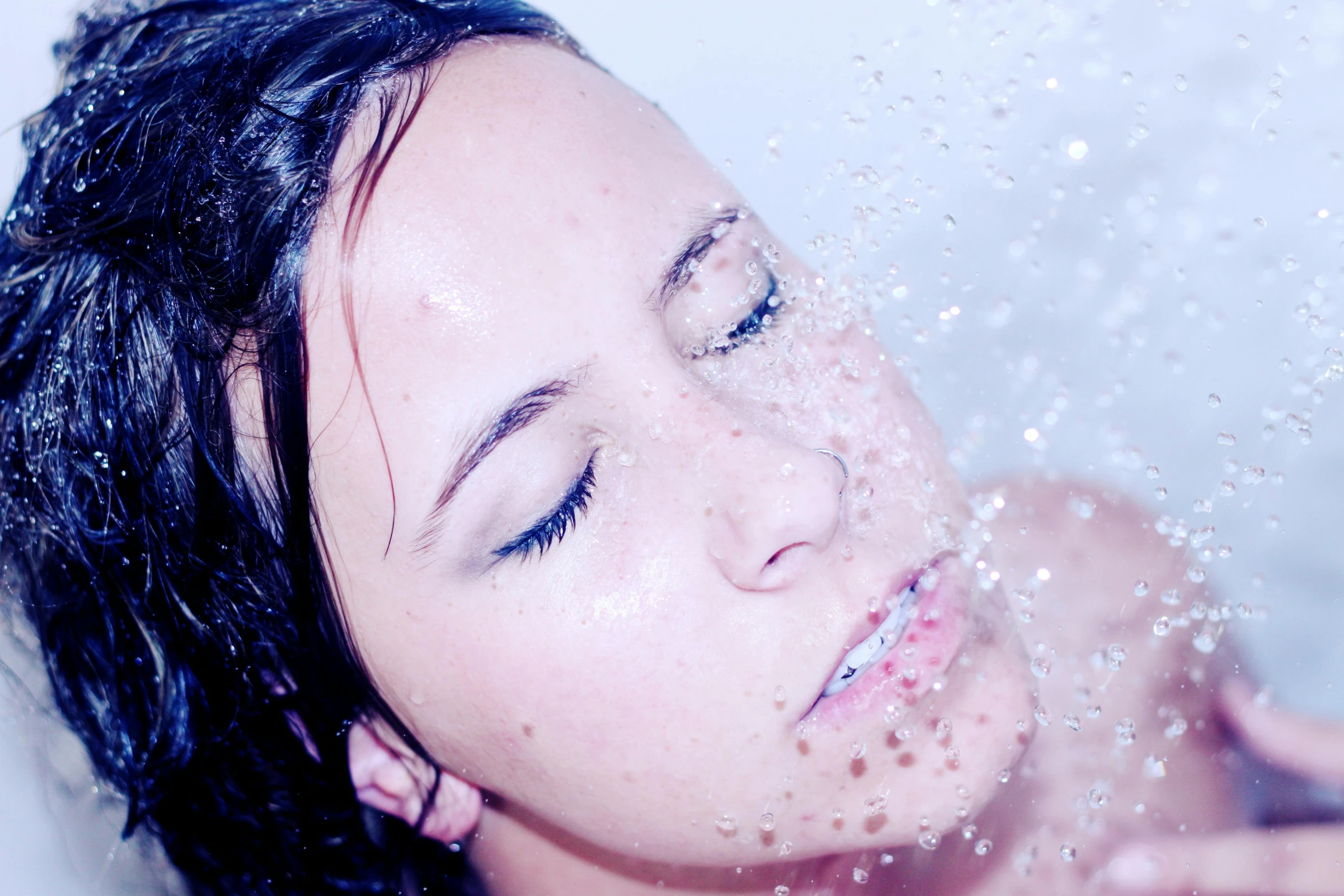 a close up of a person in a bath tub, profile image, waterfals, blue