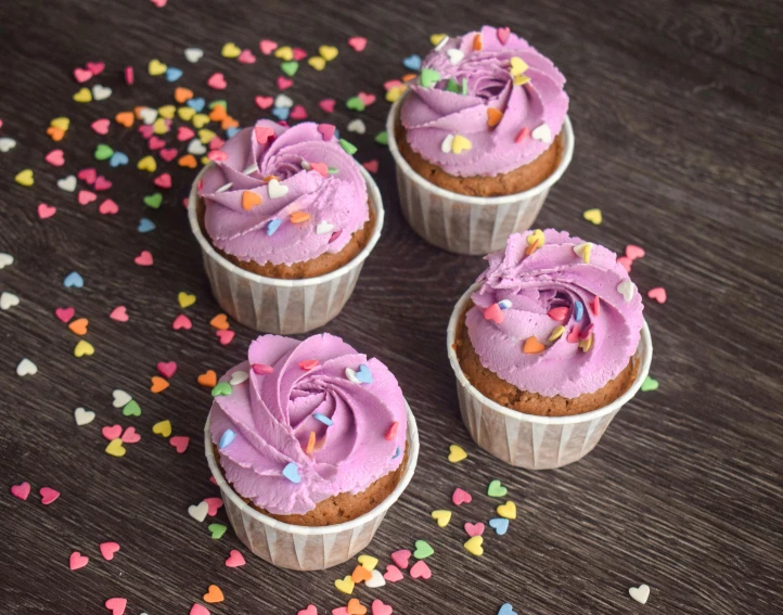 three cupcakes with pink frosting and sprinkles, pexels, renaissance, ((purple)), multicolor, rustic, multi-part