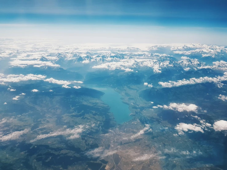 a view of a lake and mountains from an airplane, pexels contest winner, figuration libre, panels, planet in the sky, footage from space camera, lush scenery