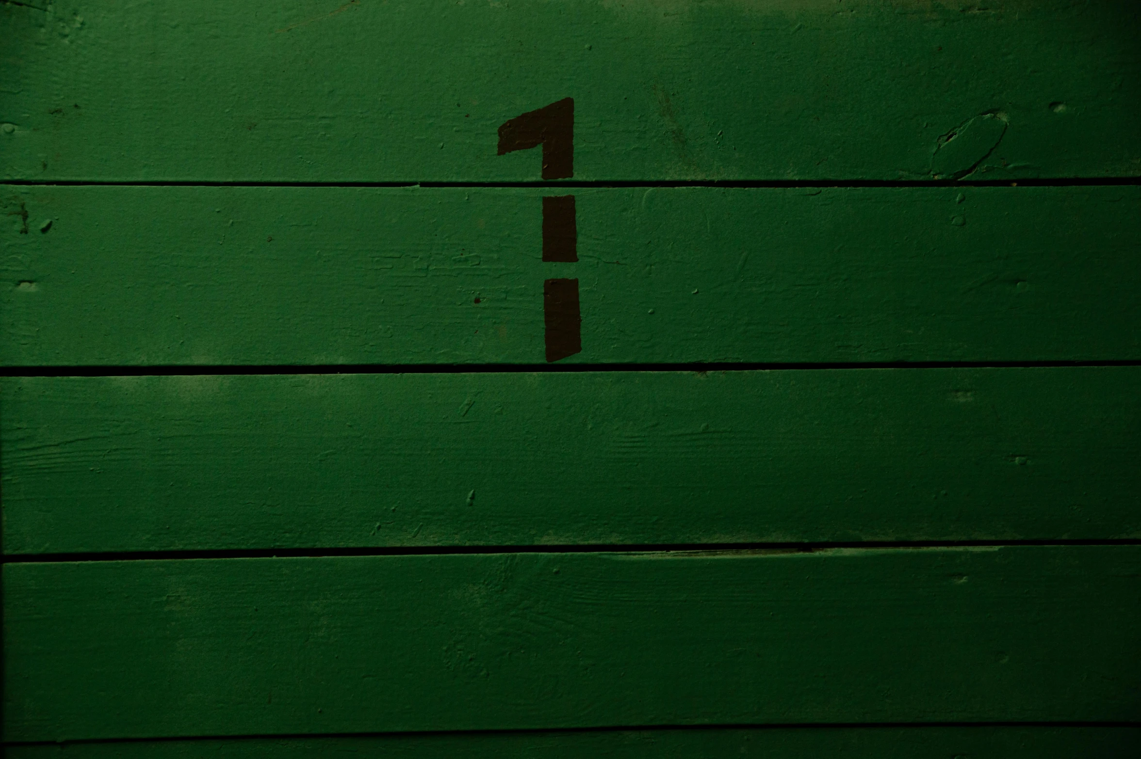 a green door with a number one painted on it, an album cover, by Elsa Bleda, pexels contest winner, wood surface, 15081959 21121991 01012000 4k, ( ( dark skin ) ), first person