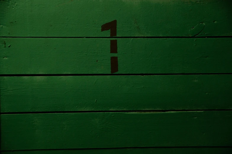 a green door with a number one painted on it, an album cover, by Elsa Bleda, pexels contest winner, wood surface, 15081959 21121991 01012000 4k, ( ( dark skin ) ), first person
