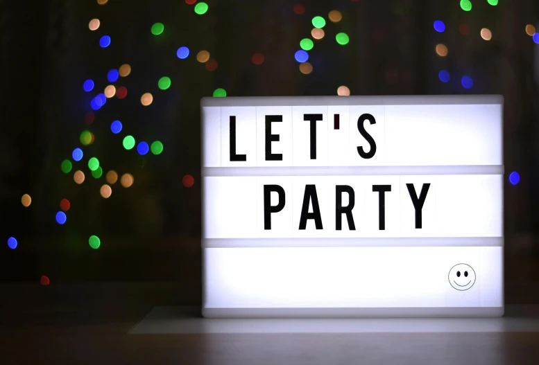 a lit up sign that says let's party, pexels, light box, background image, white, amanda clarke