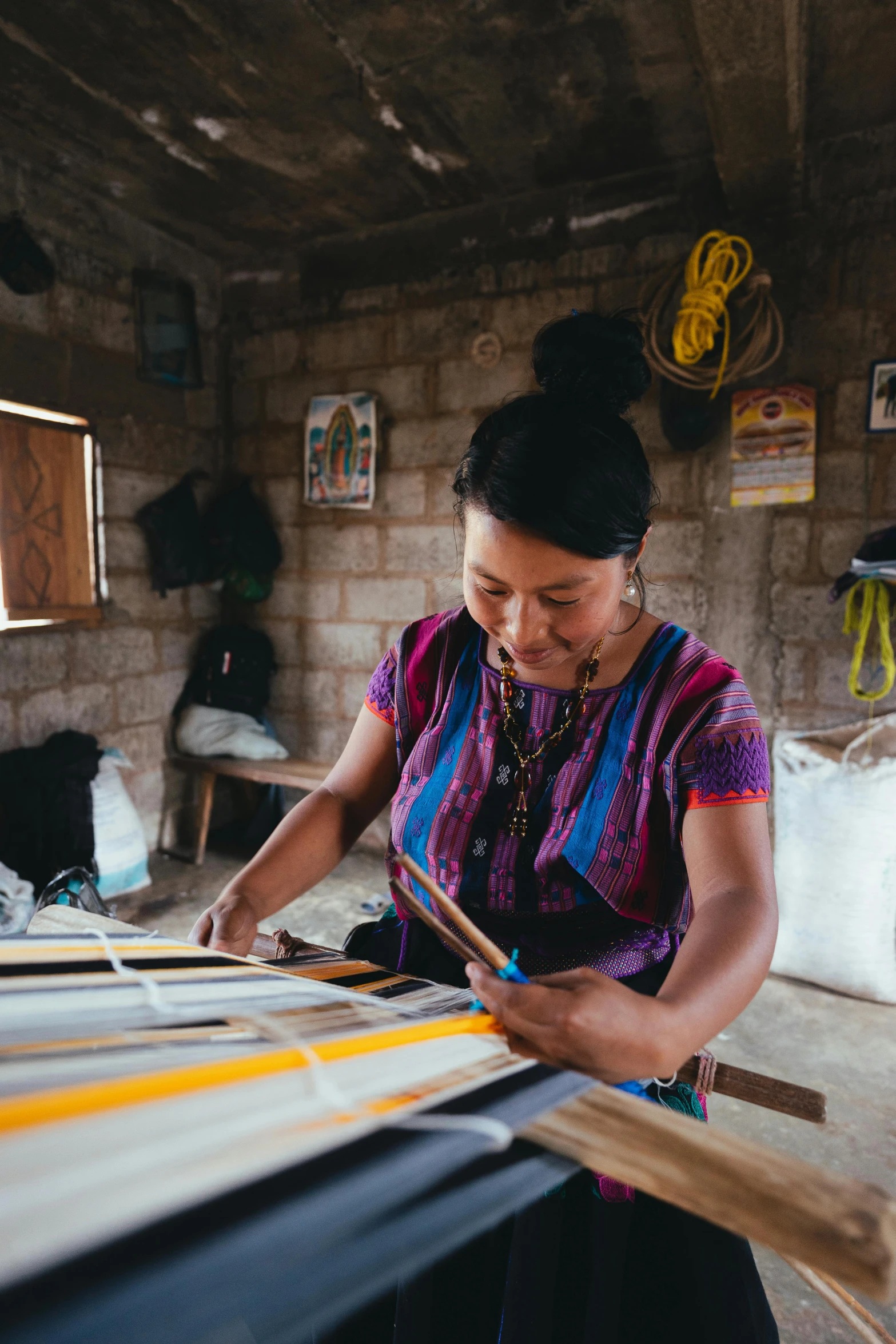 a woman is working on a weaving machine, finely painted, sustainable materials, thumbnail, charts