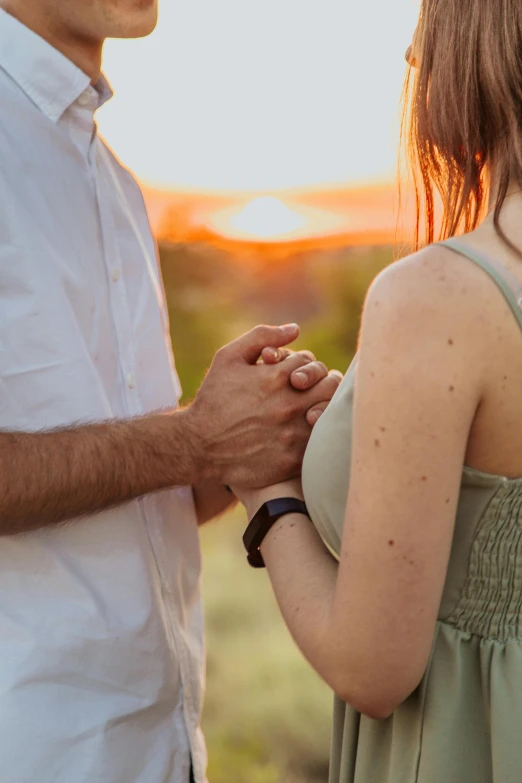 a man and a woman standing next to each other, pexels contest winner, beautiful late afternoon, hands, flirty, uploaded