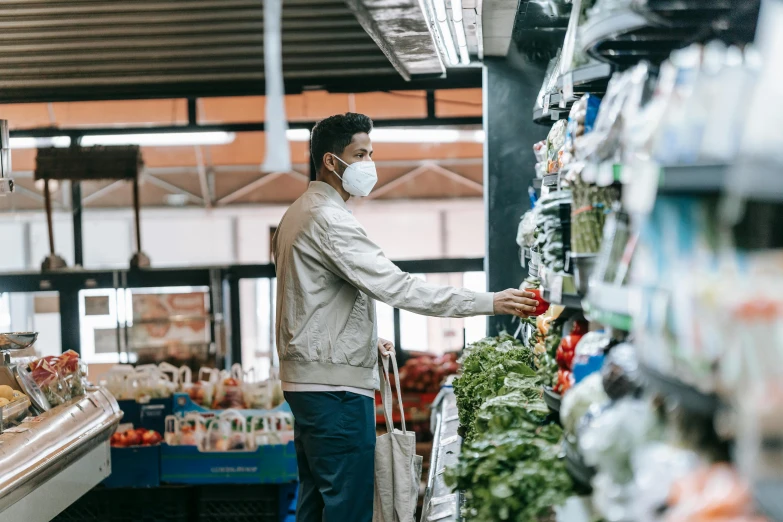 a man in a face mask shopping in a grocery store, pexels, renaissance, 🦩🪐🐞👩🏻🦳, fresh food market people, avatar image, urban surroundings