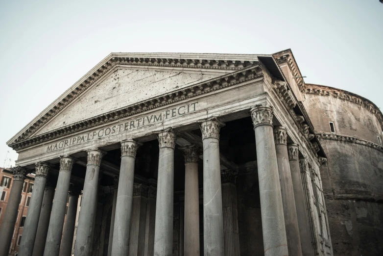 a group of people standing in front of a building, inspired by Romano Vio, pexels contest winner, neoclassicism, tombs, brown, pantheon, rustic