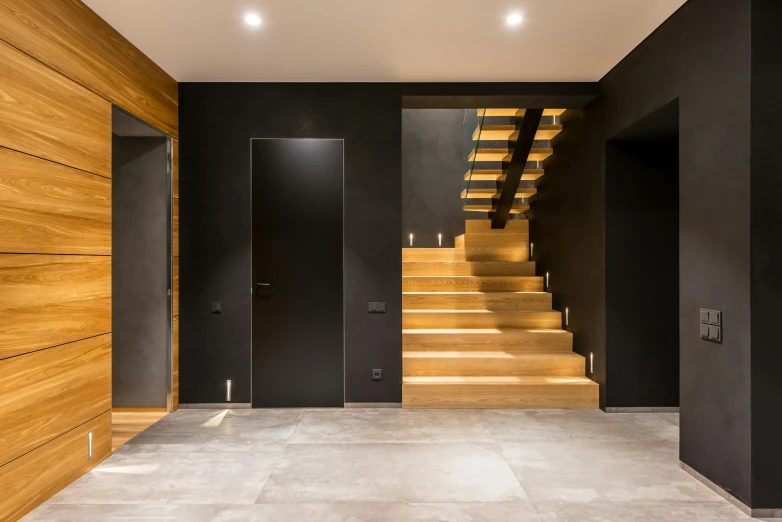 a hallway with wooden stairs and black walls, pexels contest winner, neo kyiv, polished concrete, high quality photo, thumbnail