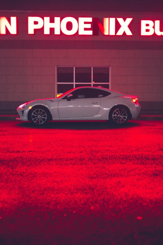 a white sports car parked in front of a building, inspired by Elsa Bleda, unsplash contest winner, glowing red veins, square, low quality photo, furious lights