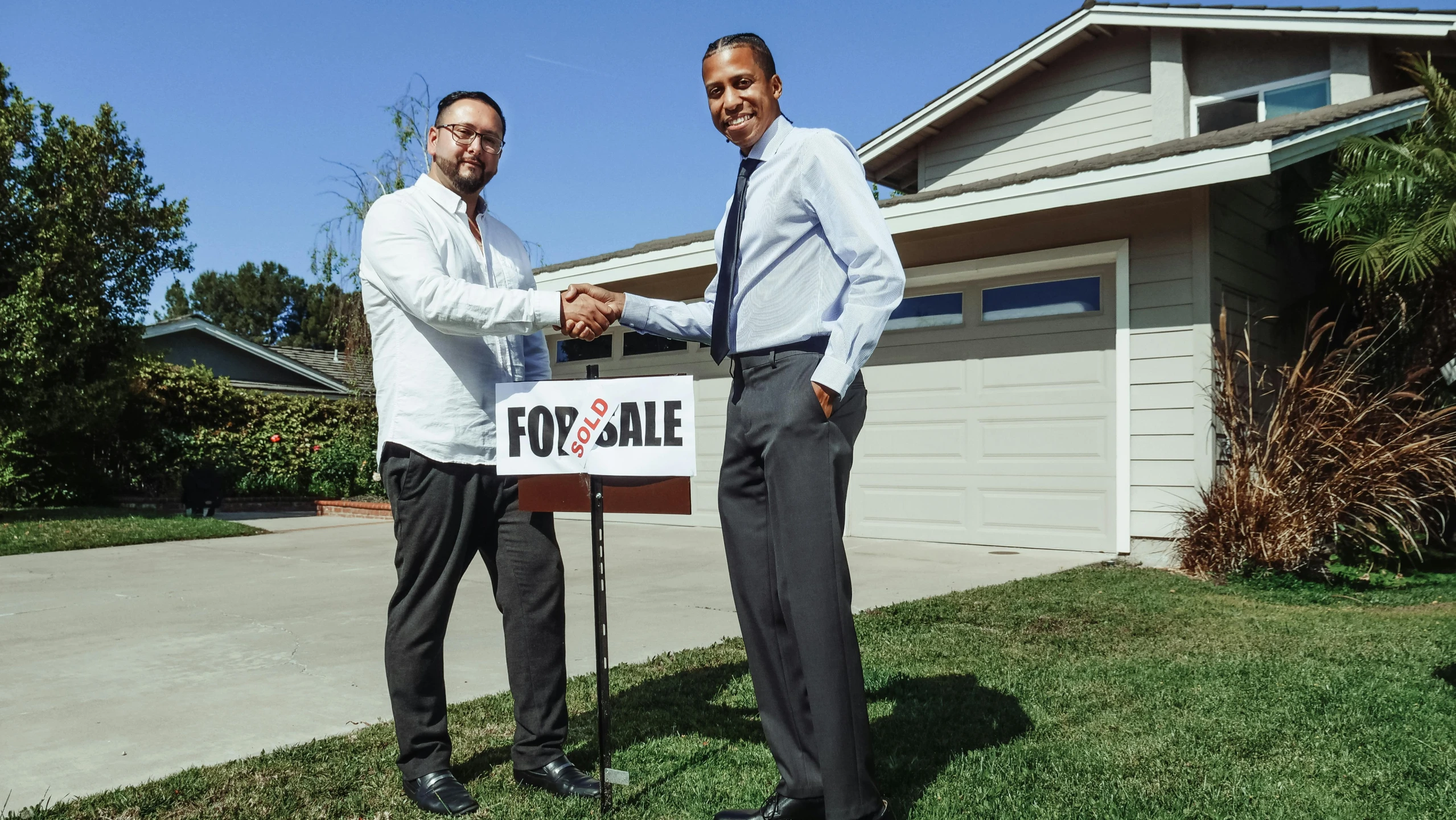 two men shaking hands in front of a for sale sign, pexels contest winner, american suburb, avatar image, full body in shot, in front of the house