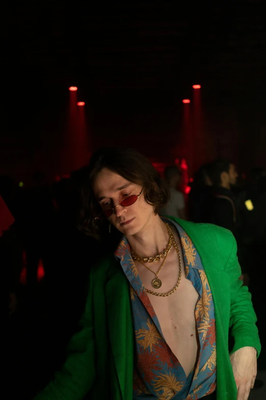 a woman cutting a cake at a party, an album cover, inspired by Eugene Leroy, trending on pexels, joe keery, menacing look, shades green and red, [ theatrical ]