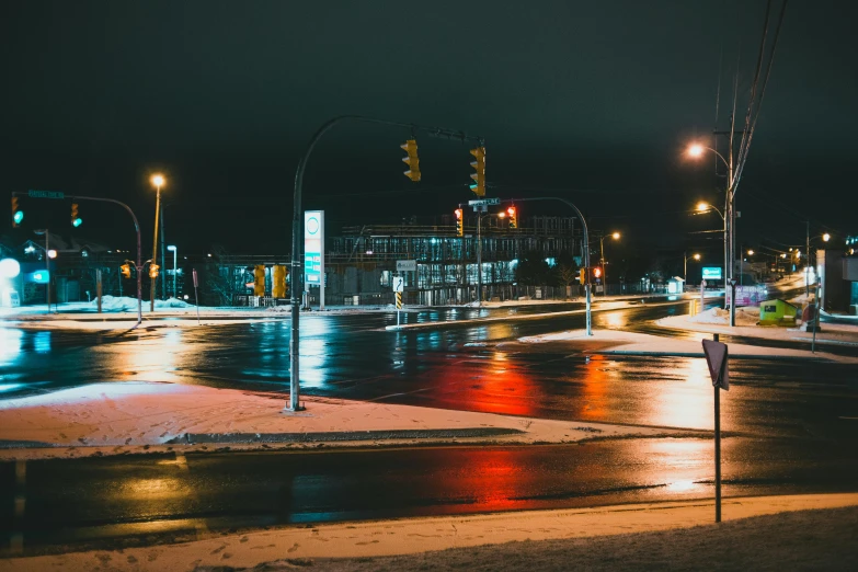 a city street filled with lots of traffic at night, by Adam Marczyński, pexels contest winner, visual art, cold scene, intersection, in a suburb, cold hues