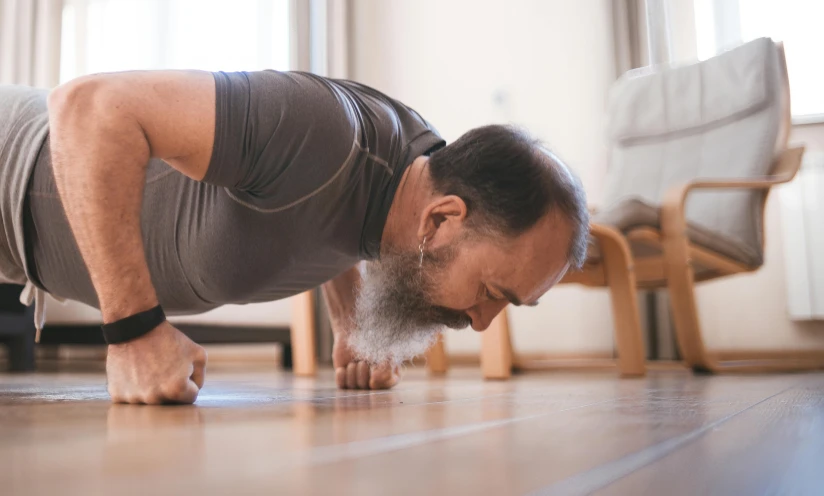 a man doing push ups on a hard wood floor, a photo, pexels contest winner, figuration libre, old gigachad with grey beard, profile image, avatar image, indoor picture