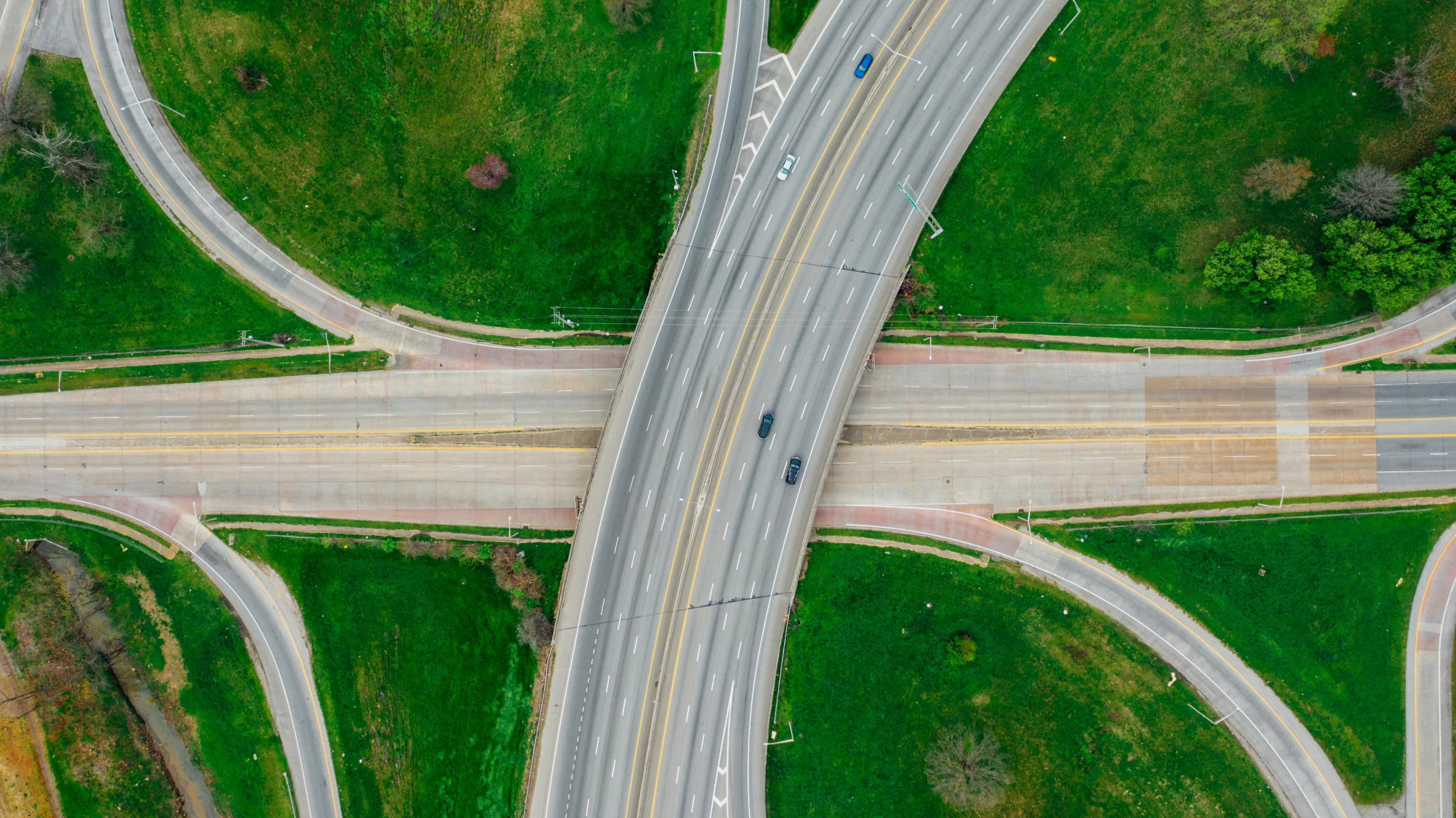 an aerial view of a highway intersection, by Carey Morris, pexels contest winner, realism, a green, post grunge, thumbnail, overpass