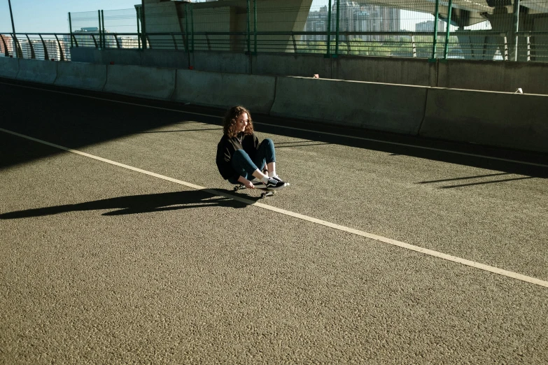 a person sitting on a skateboard in a parking lot, inspired by Elsa Bleda, realism, 15081959 21121991 01012000 4k, high shadow, on a football field, dasha taran