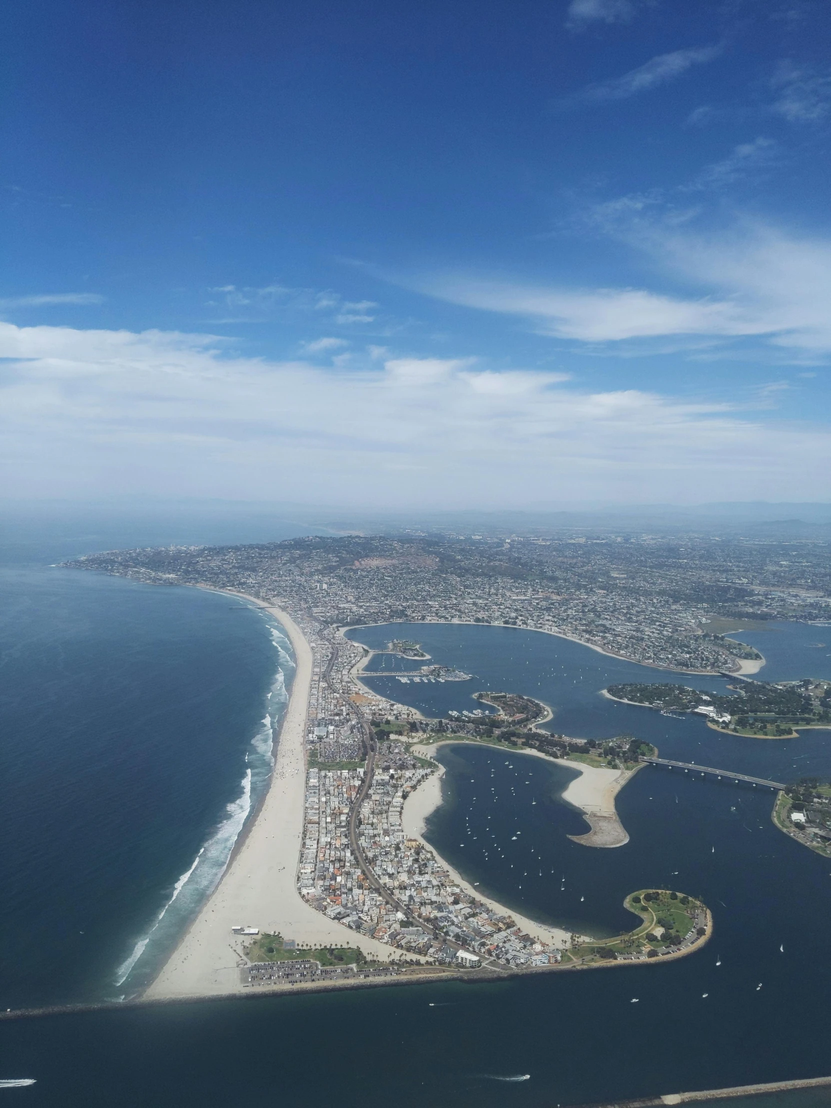 an aerial view of a large body of water, martin sandiego, bird's eye view of a city, lots of ocean, islands!!!!!