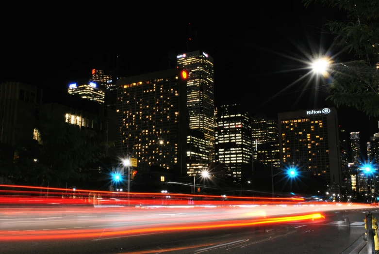 a city street filled with lots of traffic at night, by David Donaldson, pexels contest winner, the city of toronto, capital plaza, college, melbourne