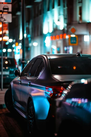 cars parked on a city street at night, by Adam Marczyński, pexels contest winner, realism, rear lighting, bokeh chrome accents, black car, teal lights