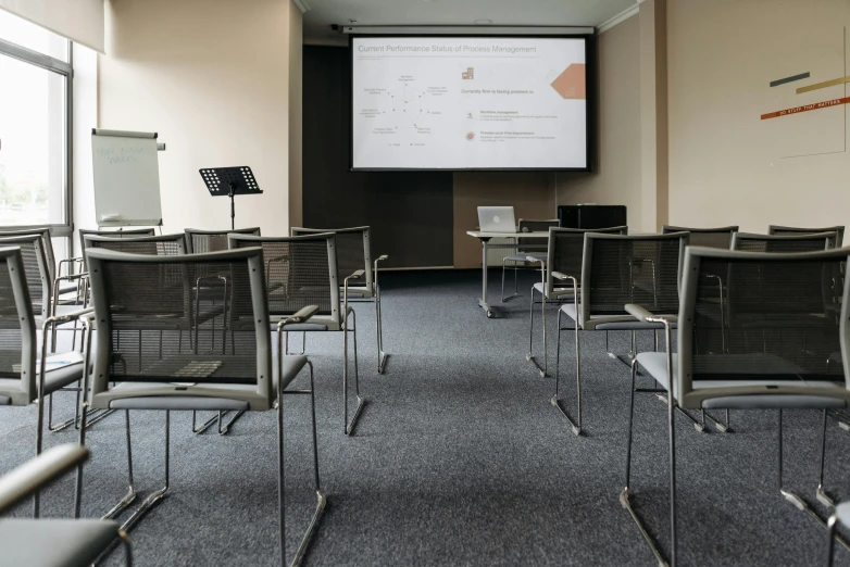 a conference room with chairs and a projector screen, a portrait, unsplash, danube school, private academy entrance, thumbnail, 1 0 / 1 0, high-resolution