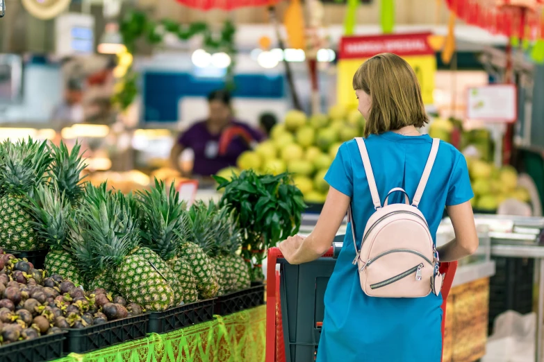 a woman is shopping in a grocery store, by Julia Pishtar, pexels, happening, square, lush surroundings, colorful scene, facing away