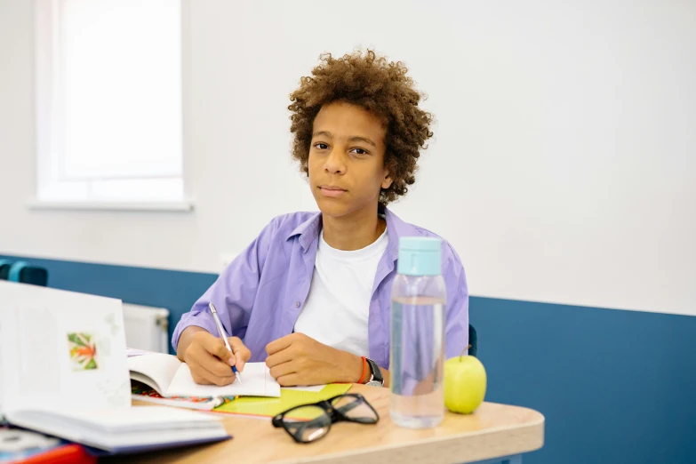 a woman sitting at a desk in front of a laptop computer, trending on pexels, danube school, black teenage boy, no watermarks, violet myers, high quality image