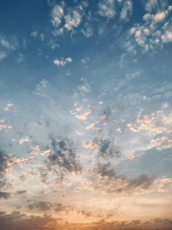 a large body of water under a cloudy sky, a picture, trending on unsplash, romanticism, major arcana sky, looking upwards, early morning sun in the sky, ☁🌪🌙👩🏾