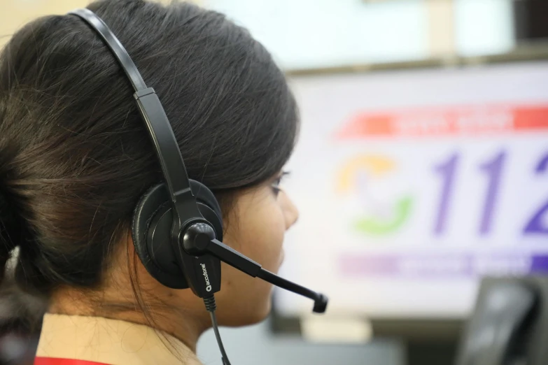 a close up of a person wearing a headset, in an call centre office, nivanh chanthara, sakimichan, banner