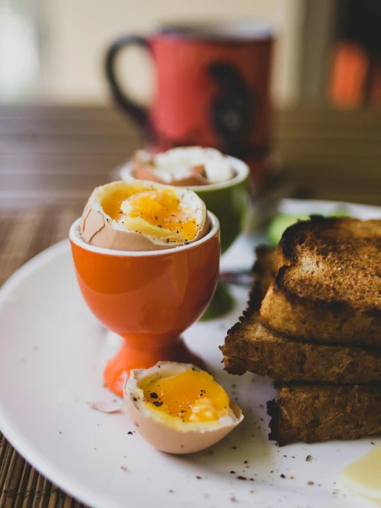 a white plate topped with toast and eggs, a still life, by Jessie Algie, pexels contest winner, vin diesel head in egg cup, outside, woodfired, malaysian