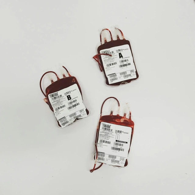 a group of blood bags sitting on top of a table, 3 - piece, labels, 2010s, sensors