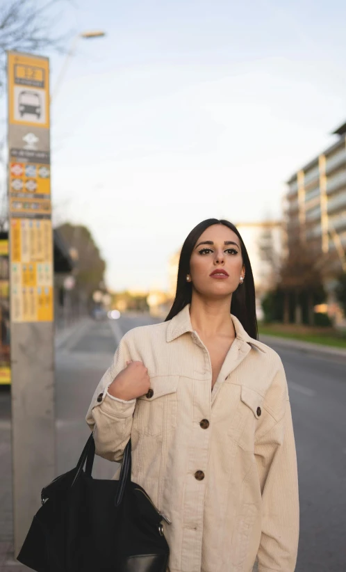 a woman standing on the side of a street, trending on pexels, realism, australian, 15081959 21121991 01012000 4k