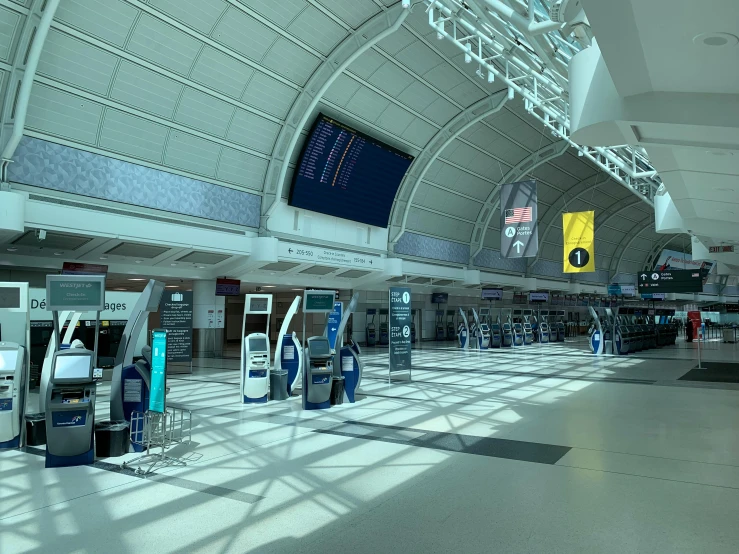 a terminal filled with lots of machines next to each other, a picture, curved hallways, airplanes, avatar image, new jersey