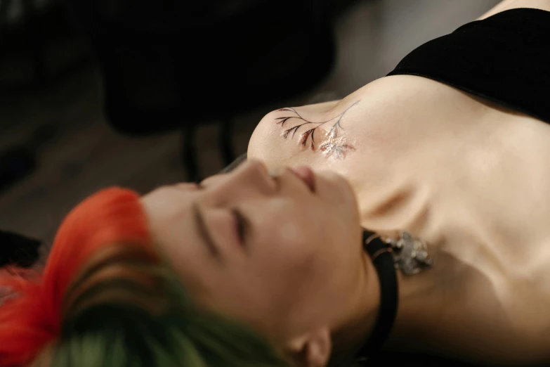 a woman laying down with a tattoo on her chest, trending on pexels, hyperrealism, stitches, surgery, nose piercing, set photo