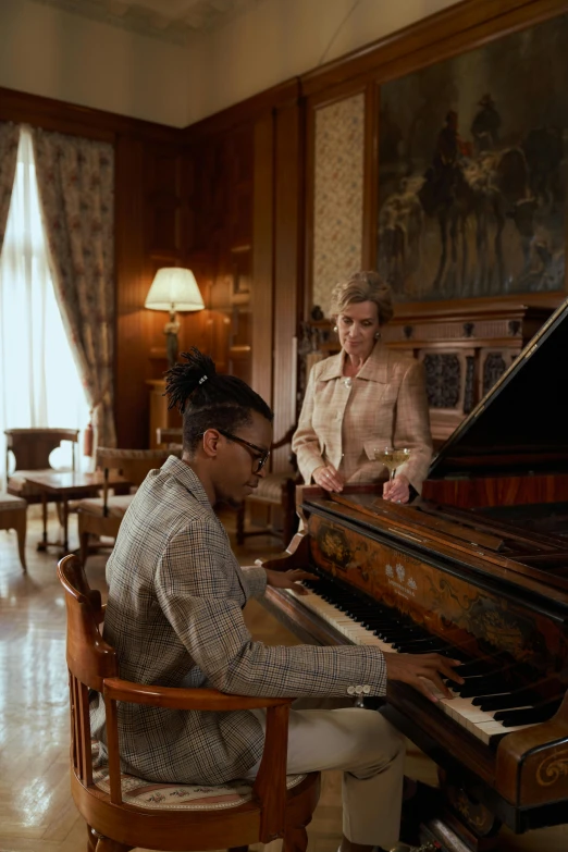 a man sitting at a piano next to a woman, wes anderson film, wiz khalifa, sony pictures, big sky