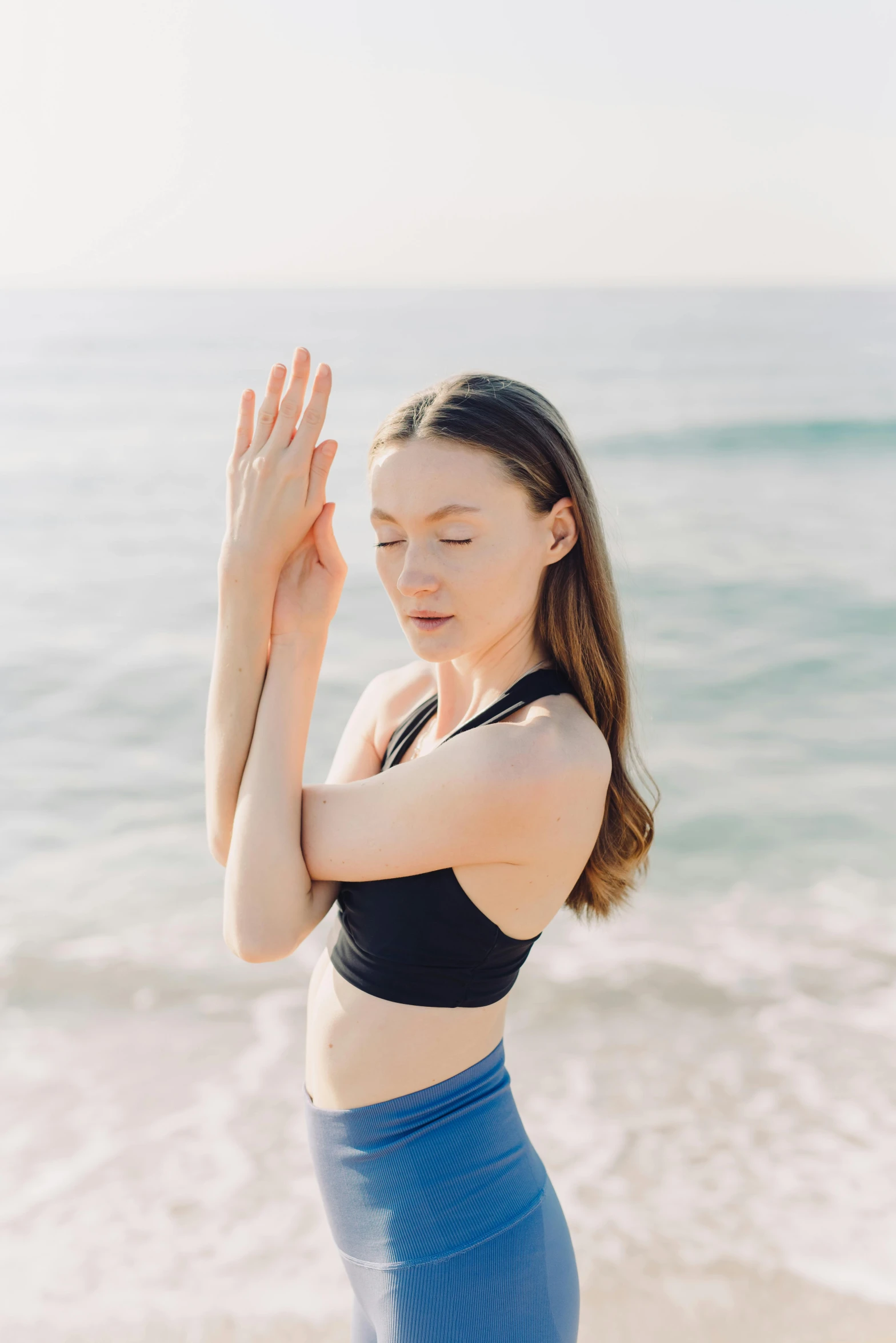 a woman doing yoga on the beach, unsplash, renaissance, portrait sophie mudd, hand gestures, profile image, anna nikonova aka newmilky