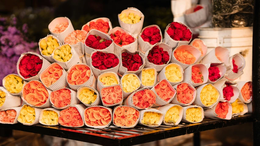 a bunch of flowers sitting on top of a table, food stall, profile image, many origami roses, warm and vibrant colors