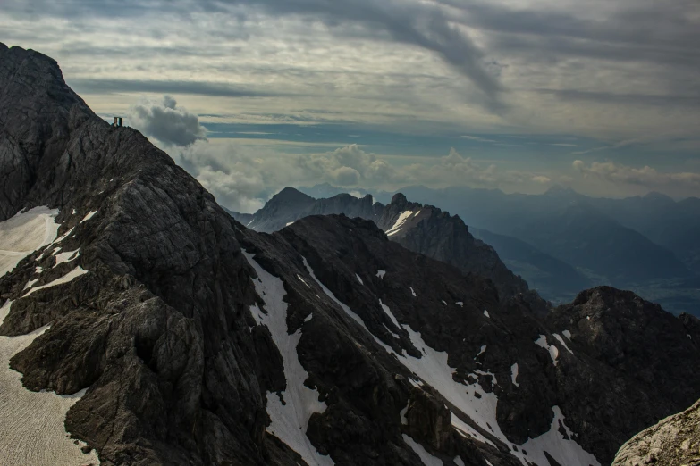 a man standing on top of a snow covered mountain, by Sebastian Spreng, pexels contest winner, fan favorite, mount olympus, panoramic, high view