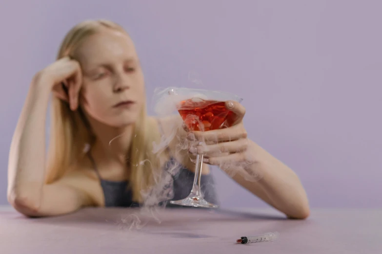 a woman sitting at a table with a glass of wine, an album cover, pexels contest winner, magic realism, drinking cough syrup, showstudio, smoke out of eyes, people drink cocktails