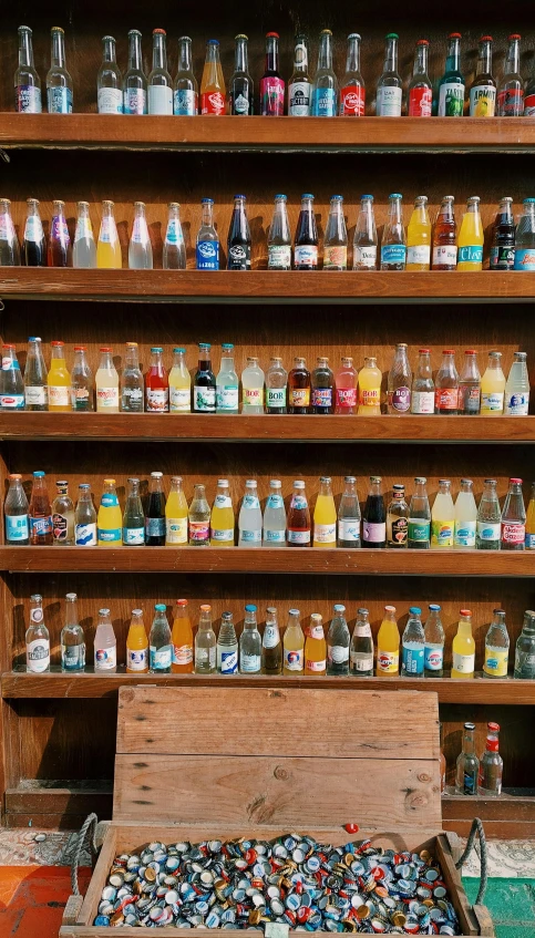 a wooden box filled with lots of bottles, by Jessie Algie, pexels, photorealism, large sweet jars on shelves, sparkling water, in style of joel meyerowitz, nostalgic and euphoric