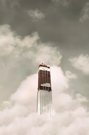 a very tall building in the middle of a cloudy sky, inspired by Christo, unsplash, joel sternfeld, under construction, overexposed photograph, promo image