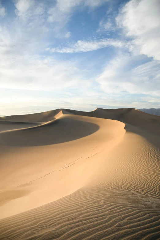 a large sand dune in the middle of a desert, by Daren Bader, fan favorite, natural morning light, 4k”