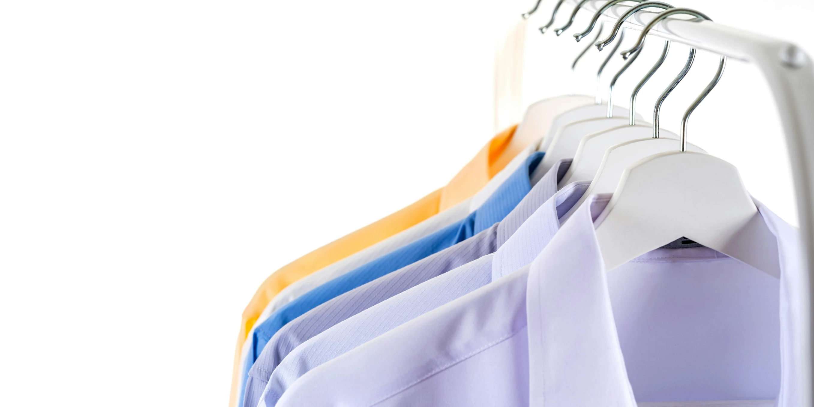 a row of shirts hanging on a clothes rack, pexels, plasticien, lavander and yellow color scheme, set against a white background, wearing a light blue shirt, thumbnail