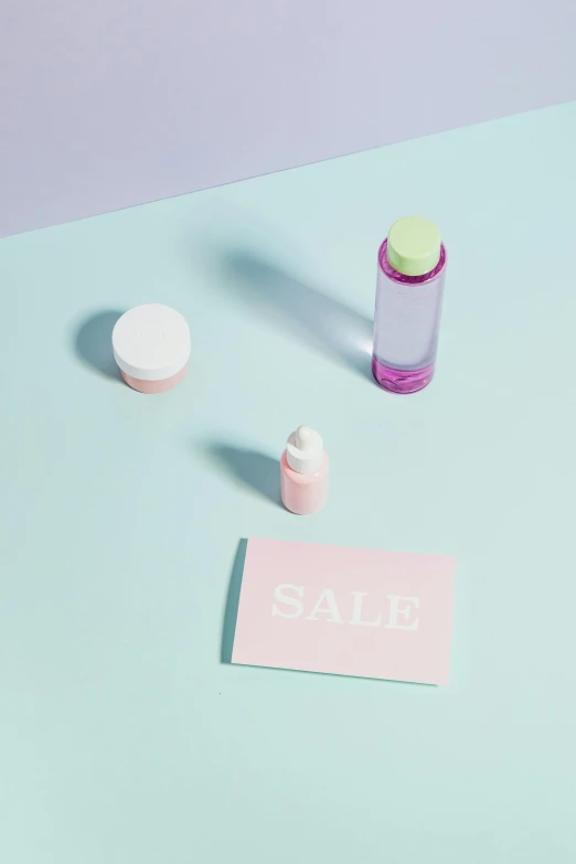 a bottle of pills next to a sale sign, by Elsa Bleda, pastel makeup, close-up product photo, small, liquids