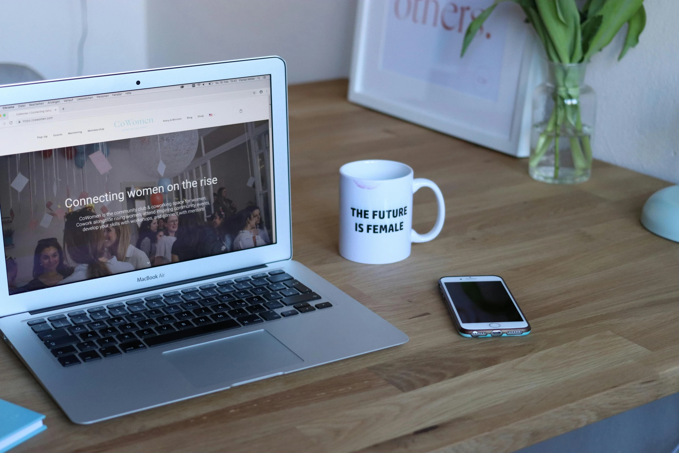 a laptop computer sitting on top of a wooden desk, by Alice Mason, featured on unsplash, happening, white mug, feminism, 9 9 designs, phone photo