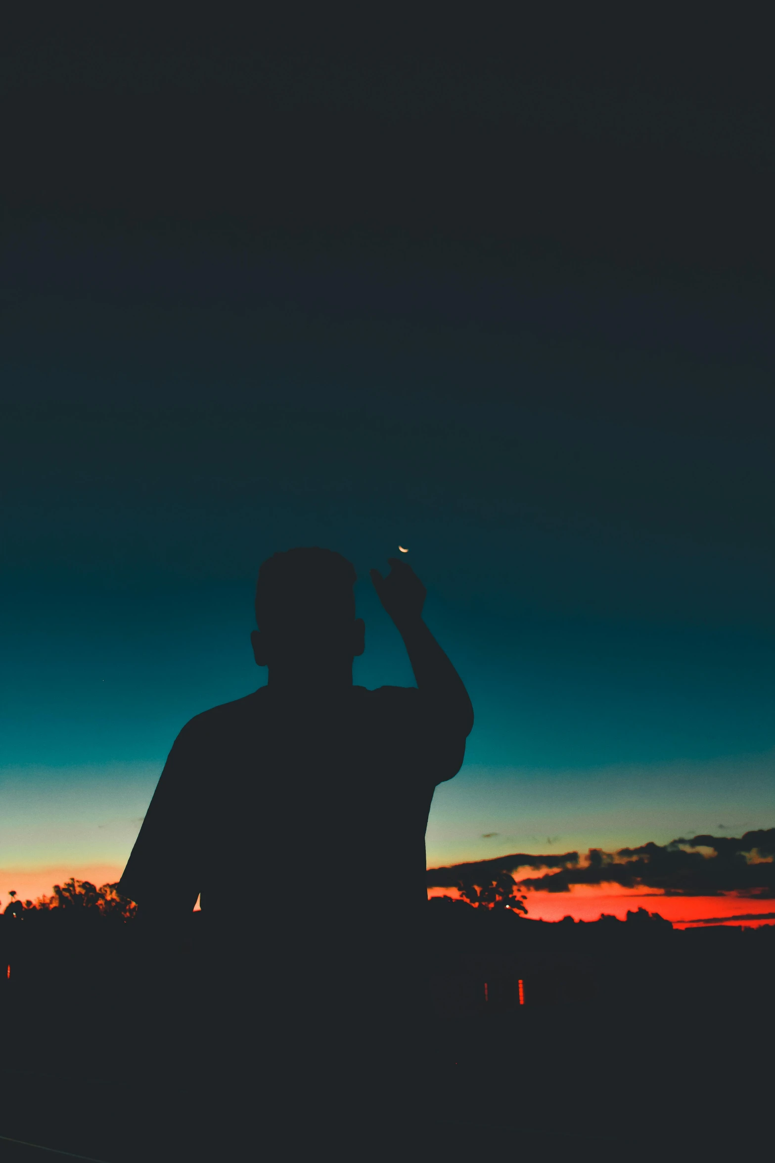 a man taking a picture of the sunset with his cell phone, by Niko Henrichon, pexels contest winner, symbolism, dabbing, looking out into space, pastel palette silhouette, 15081959 21121991 01012000 4k