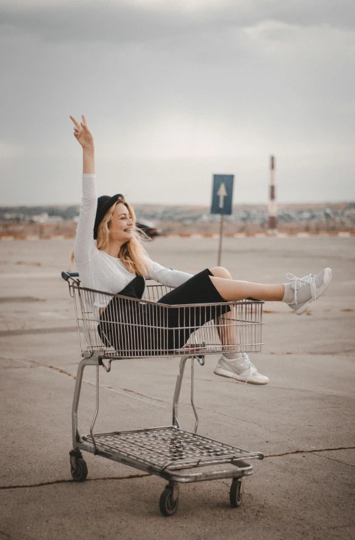 a woman sitting on top of a shopping cart, pexels contest winner, fun pose, full body action pose, happy girl, #trending