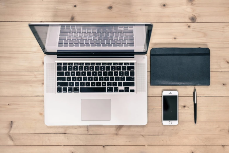 an open laptop computer sitting on top of a wooden table, pexels, knolling, 9 9 designs, full body image, white