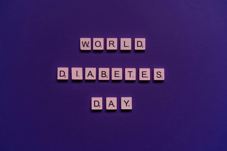 the word world diabetes's day spelled in scrabbles on a purple background, an album cover, by Meredith Dillman, pixabay, dada, background image, 🎀 🗡 🍓 🧚, engraved, people didn't notice