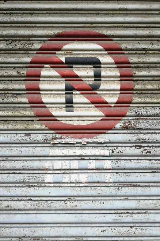 a metal door with a no parking sign on it, riot, no cropping, shutters, forbidden planet