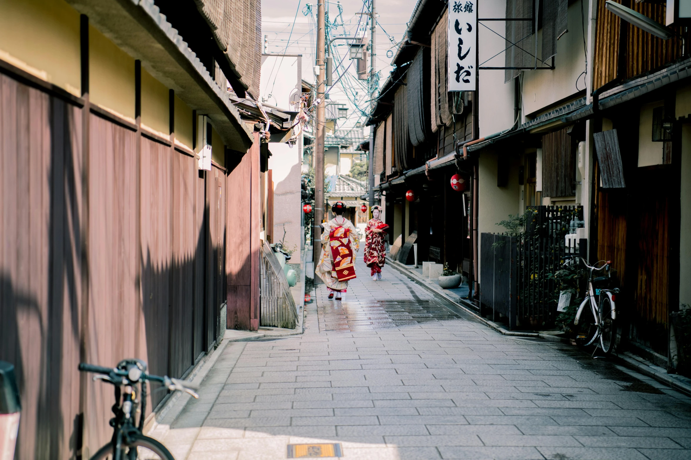 a woman in a kimono walking down a narrow alley, pexels contest winner, 🦩🪐🐞👩🏻🦳, stepping on a miniature city, sumo japanese, shady alleys